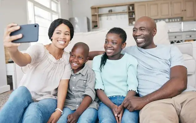 A Ghanaian family welcoming a guest into their home